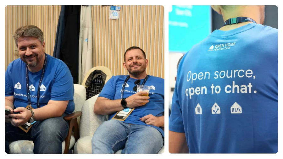 Two volunteers relaxing on the booth sofa with a beer, next to the back of a T-shirt reading “Open source, open to chat.”